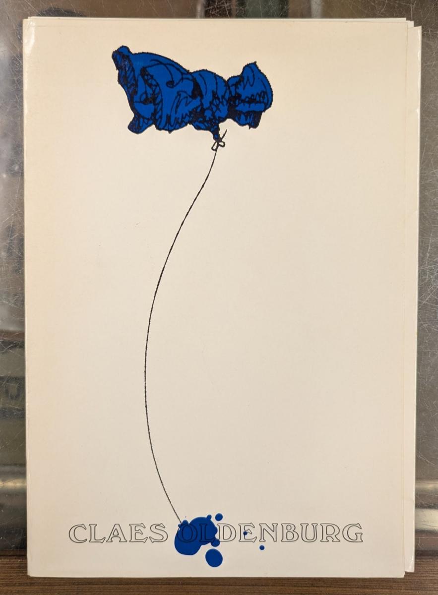 cover of Claes Oldenburg book, white background with blue and white drawing